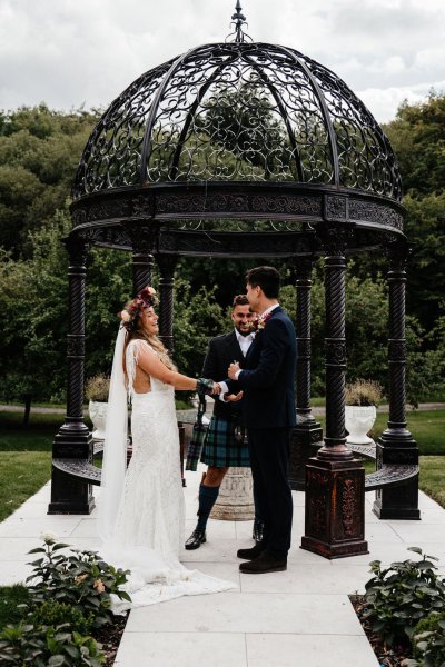 Bride and groom officiant at the alter