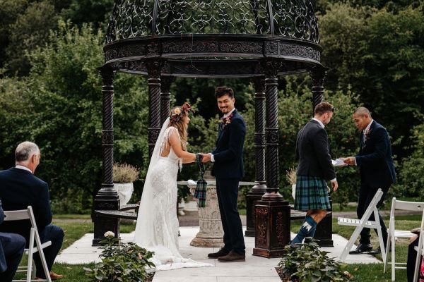 Bride and groom officiant at the alter