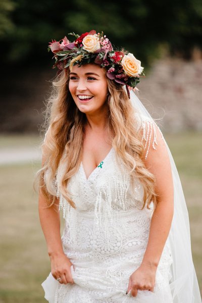 Bride on her own laughing smiling