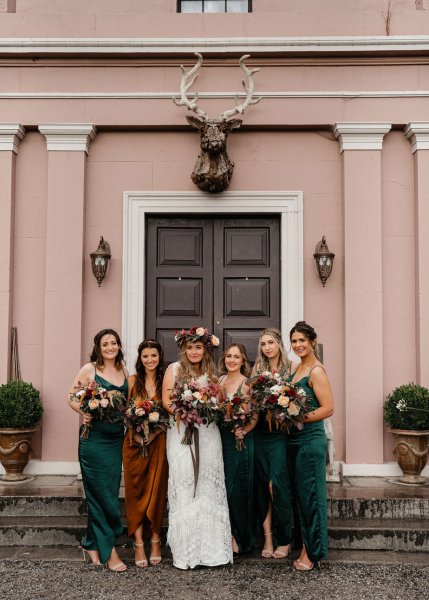 Bride and bridesmaids flowers in hands