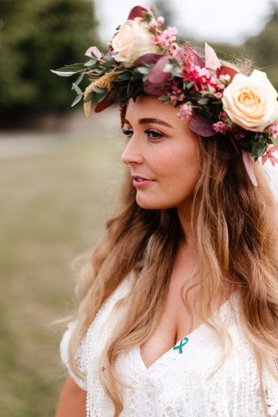 Close up detail of bride with roses flowers in her hair