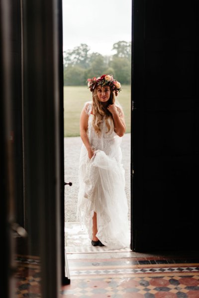 Dress/gown from behind bride entering building