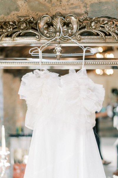 White dress hanging above