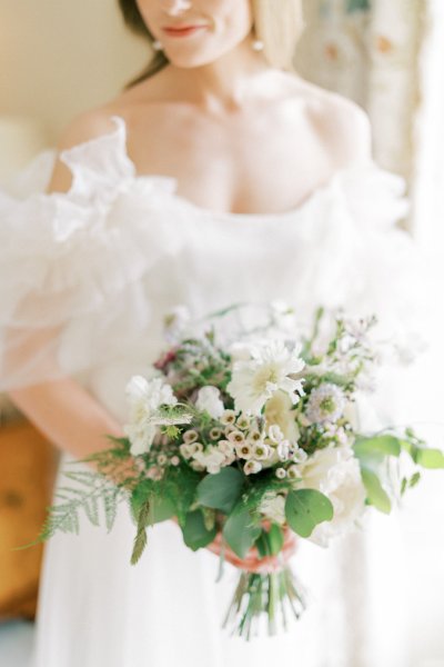 Ruffle arm off the shoulder dress/gown bridal detail flowers