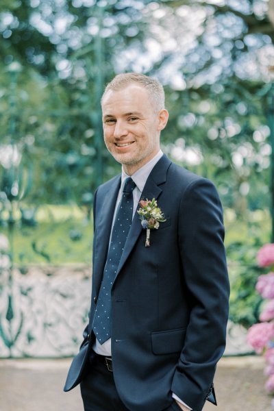 Groom poses for camera