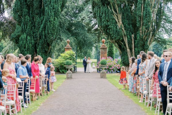 Bride and father walk up the aisle