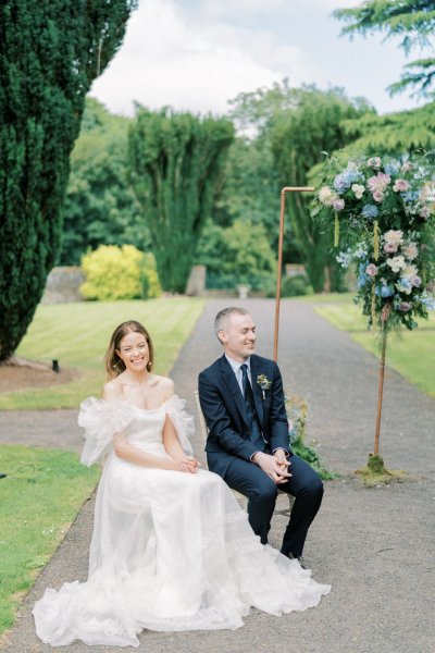 Bride and groom seated during ceremony