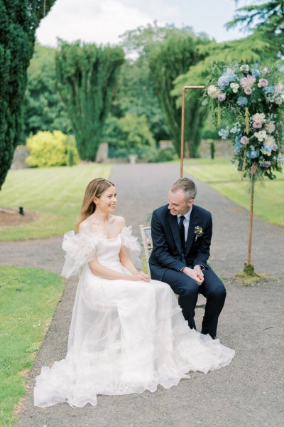 Bride and groom seated during ceremony