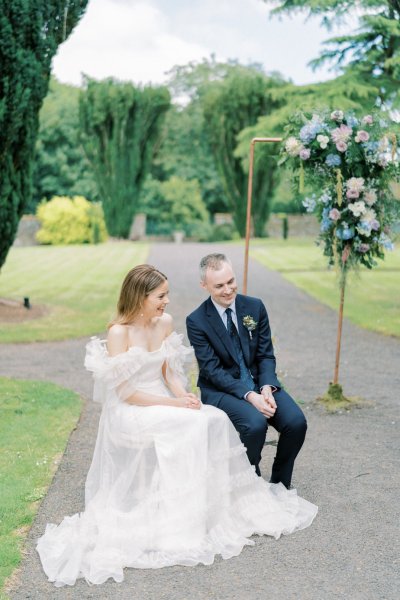 Bride and groom seated during ceremony