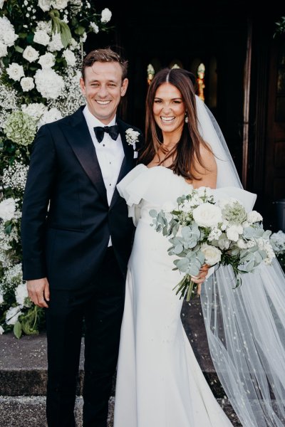 Bride and groom just wed exterior church