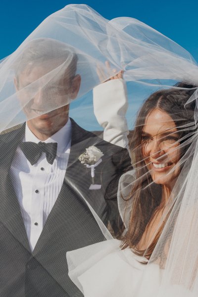 bride and groom veil blowing