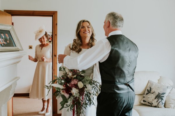 Father of the bride smiling mirror reflection