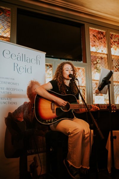 Ceallach Reid singing wedding band singer playing guitar