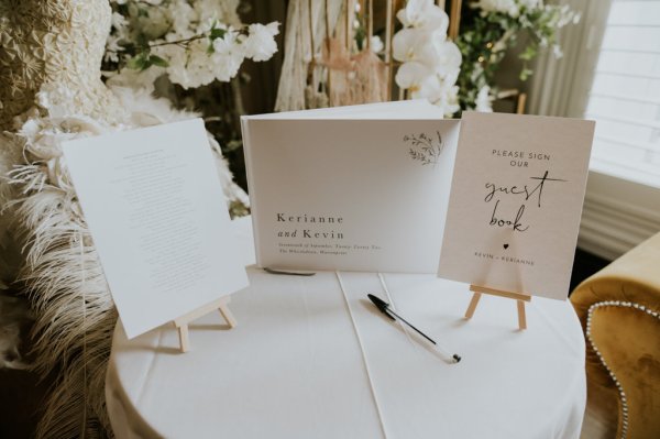 Letters on table pen flowers