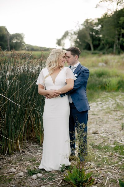 Bride and groom exterior forest sand beach setting