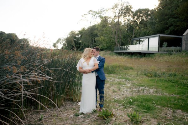 Bride and groom exterior forest sand beach setting