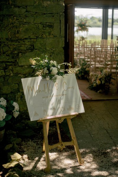 Welcome to the wedding sign board with white flowers