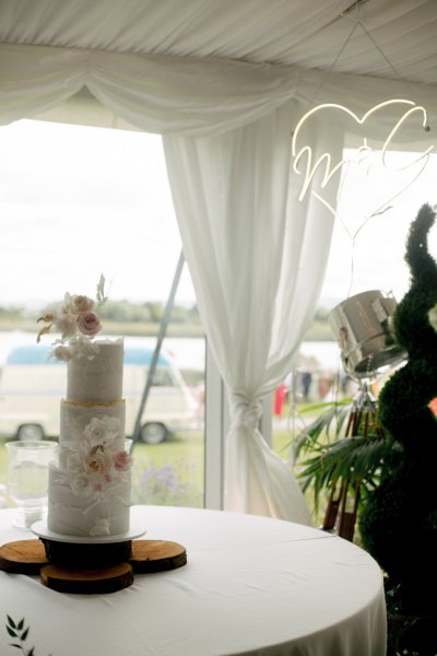 White wedding cake and flowers