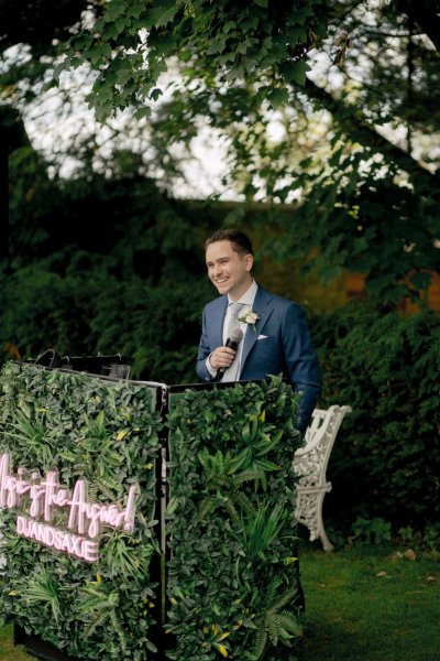 Groom smiles waiting for bride