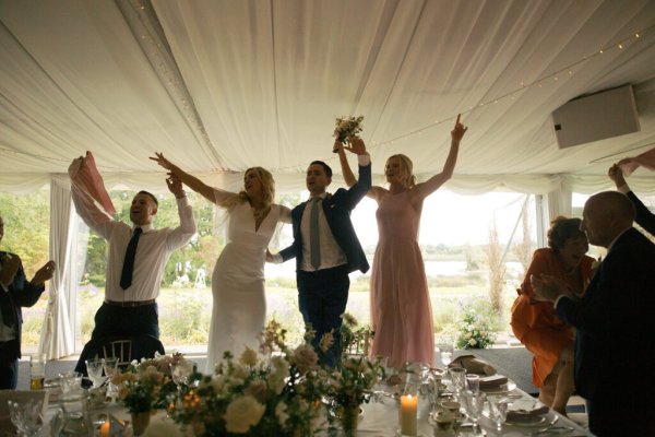 Guests and groom celebrating