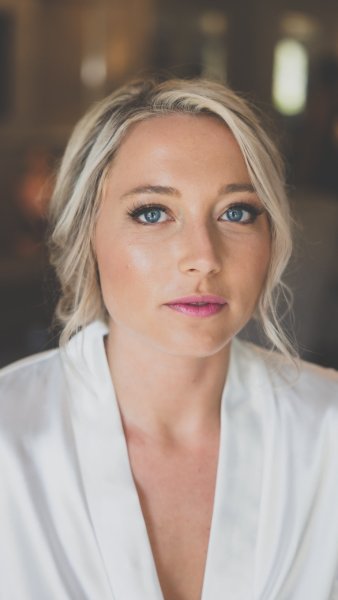 Bride getting makeup done MUA close up