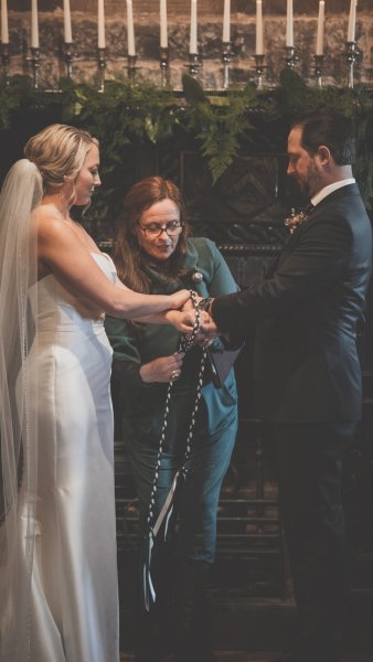 Bride groom ribbon and officiant