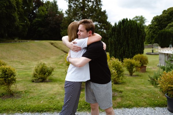 Groom and mother hug