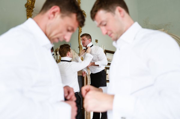 Best man groom and groomsmen getting ready