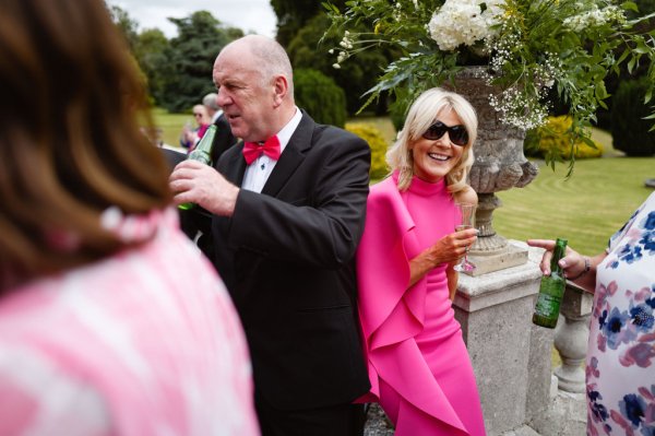 Lady in pink with gentleman