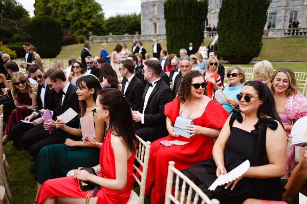 Red dresses women sitting seated