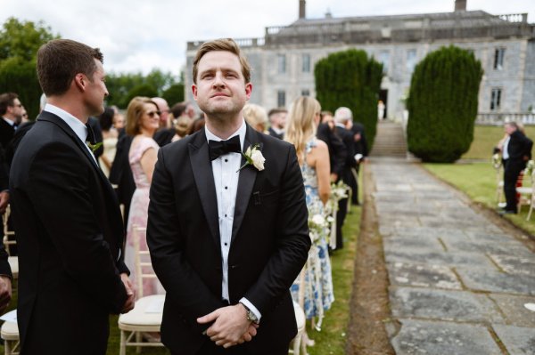 Groom awaits bride at alter