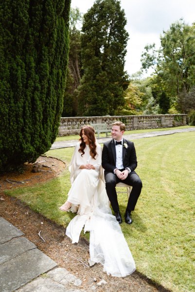 Bride and groom at alter seated sitting