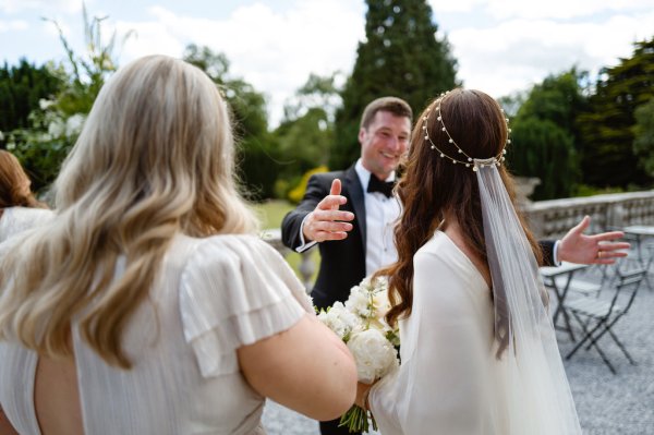 Bride hugging guest