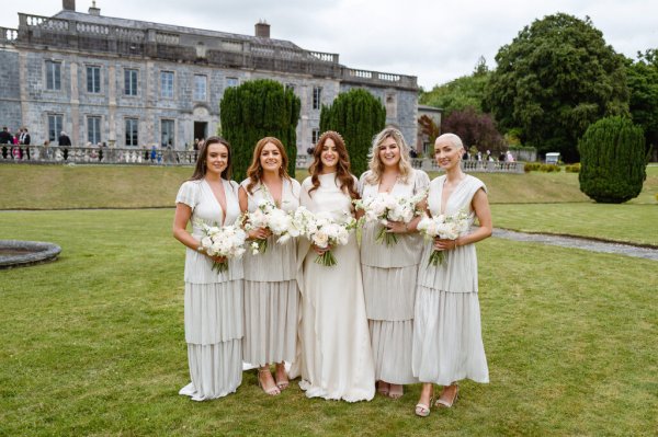 Bride and bridesmaids holding flowers/bouquet