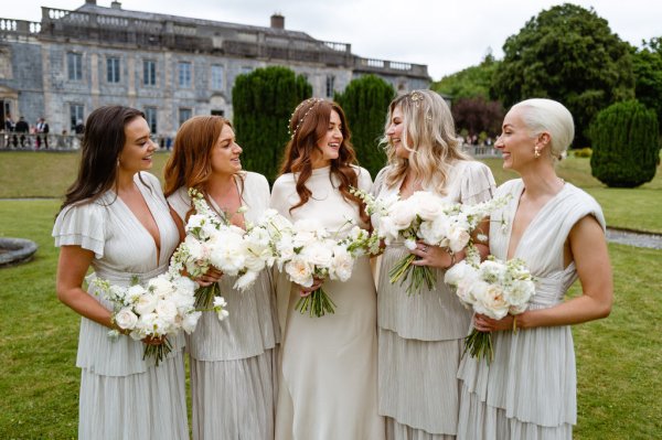 Bride and bridesmaids holding flowers/bouquet