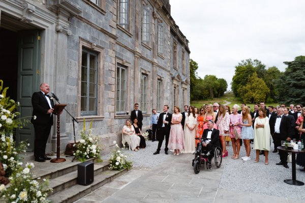 Exterior shot of guests colourful dresses