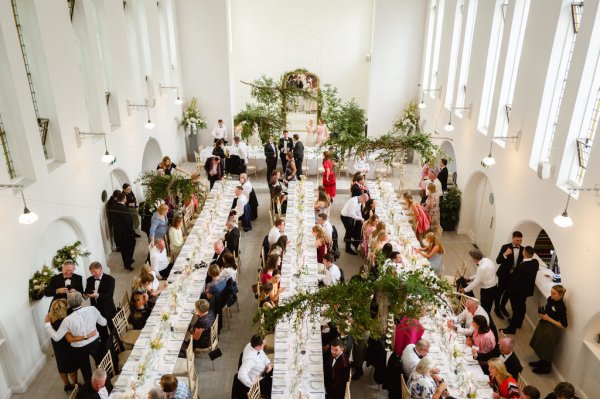 Guests seated sitting dining room from above