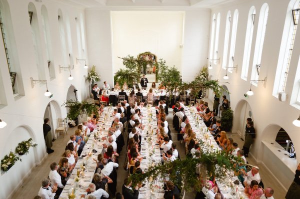 Guests seated sitting dining room from above