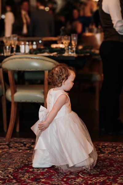 Little girl in white playing