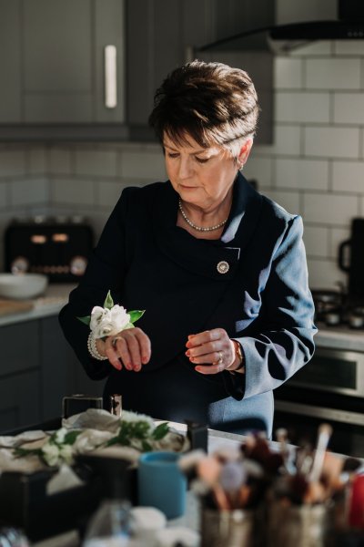 Mother wearing white rose bracelet