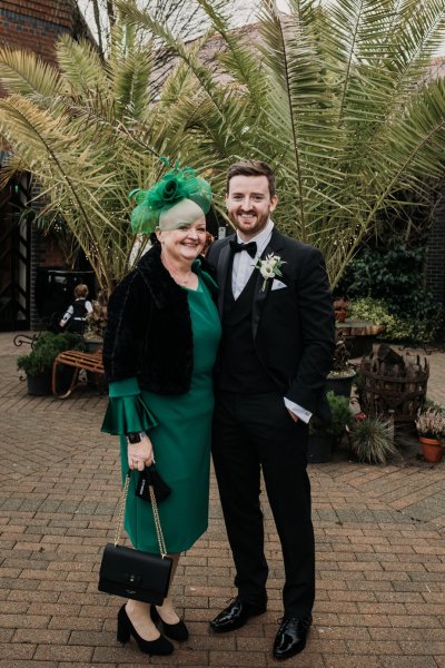 Groom and mother in green