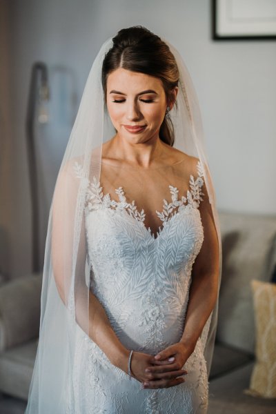 Bride is ready smiling and looking down