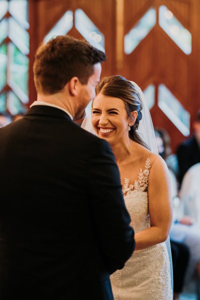 Bride and groom exchanging wedding bands/rings