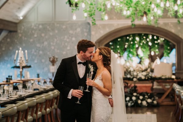 Bride and groom kiss kissing church interior