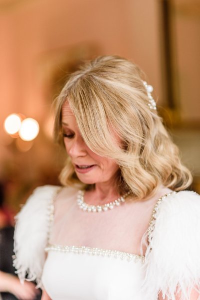 Bride reads her vows looks down