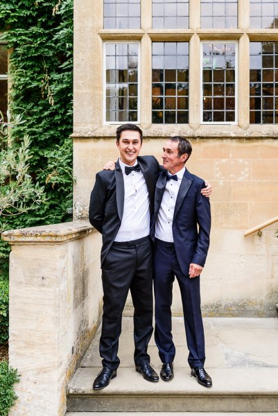 Groom and groomsman outside