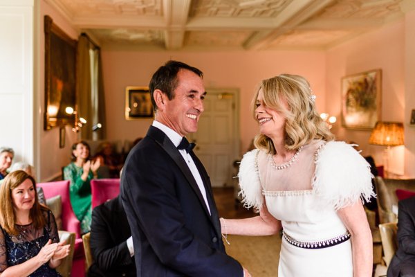 Bride and groom laughing and smiling