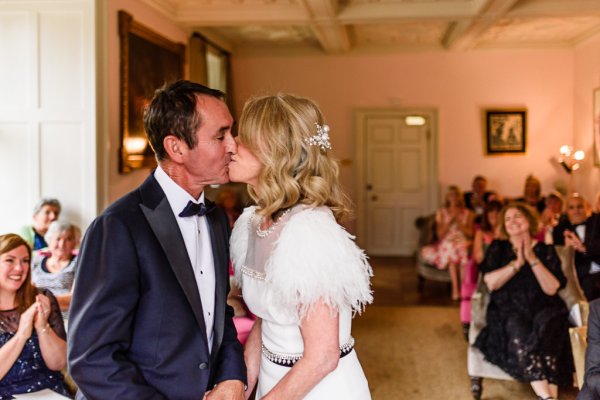 Bride and groom kiss