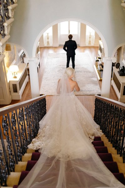 Bride walking down the stairs staircase