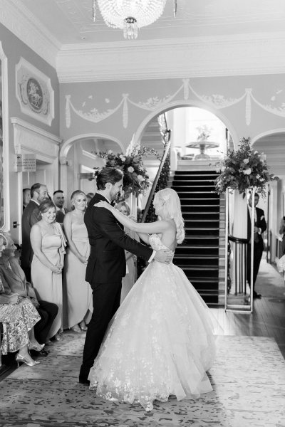 Black and white bride and groom dancing